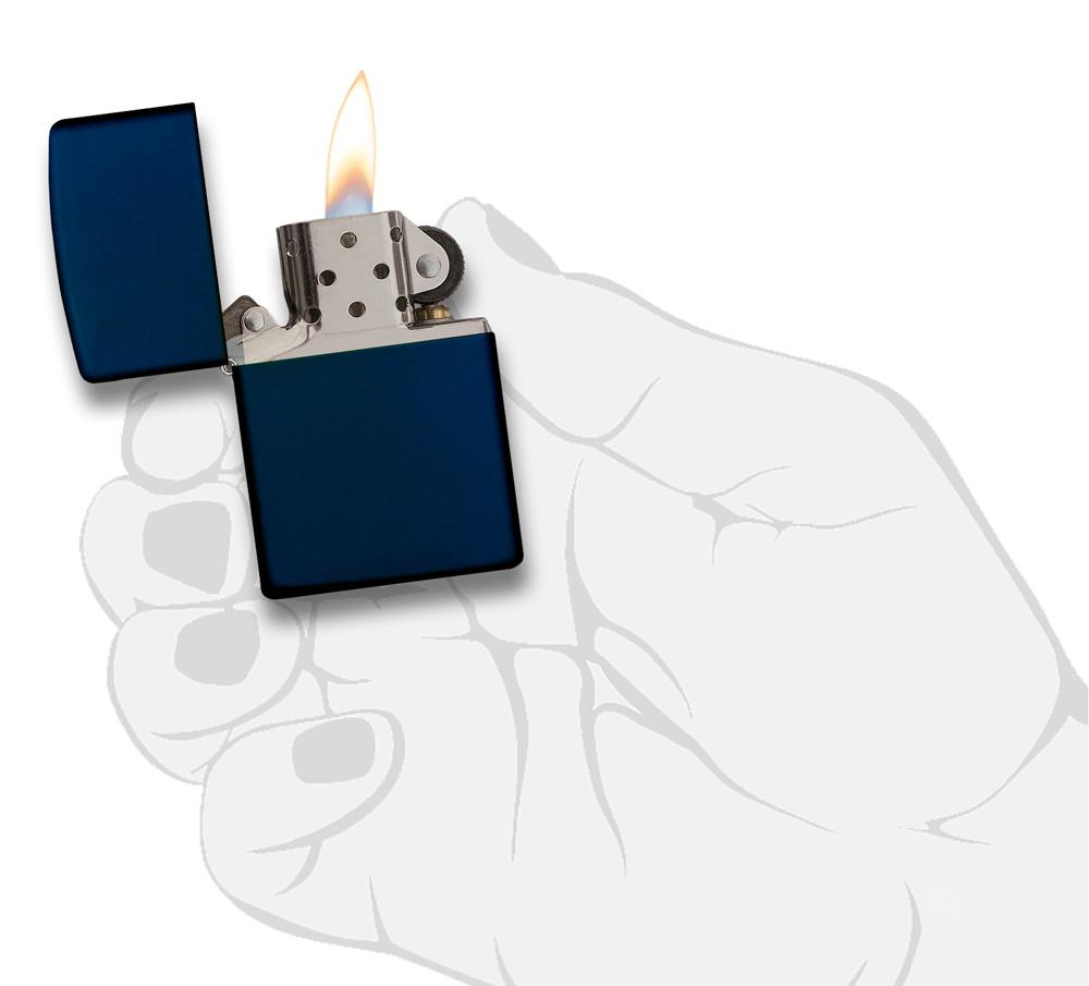 Classic Navy Matte Windproof Lighter lit in hand