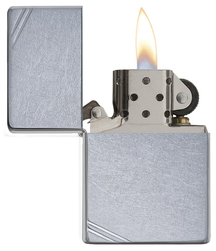 Street Chrome Vintage with Slashes Windproof Lighter with its lid open and lit
