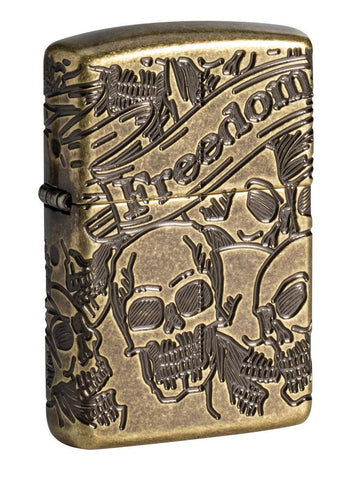 Armor® Antique Brass Skull Design Windproof Lighter standing at a 3/4 angle