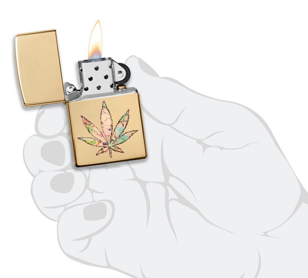 Pot Leaf Fusion Design Windproof Lighter lit in hand 