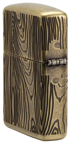 Jim Beam® Armor® Antique Brass Windproof Lighter standing at an angle showing the back and hinge side of the lighter