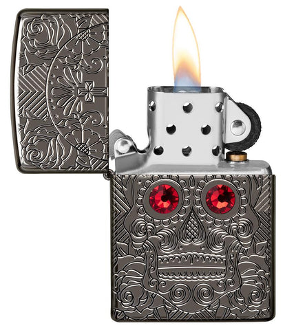 Crystal Skull Design Armor® High Polish Black Ice Windproof Lighter with its lid open and lit