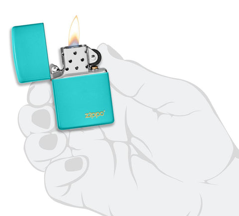 Classic Flat Turquoise Zippo Logo Windproof Lighter lit in hand