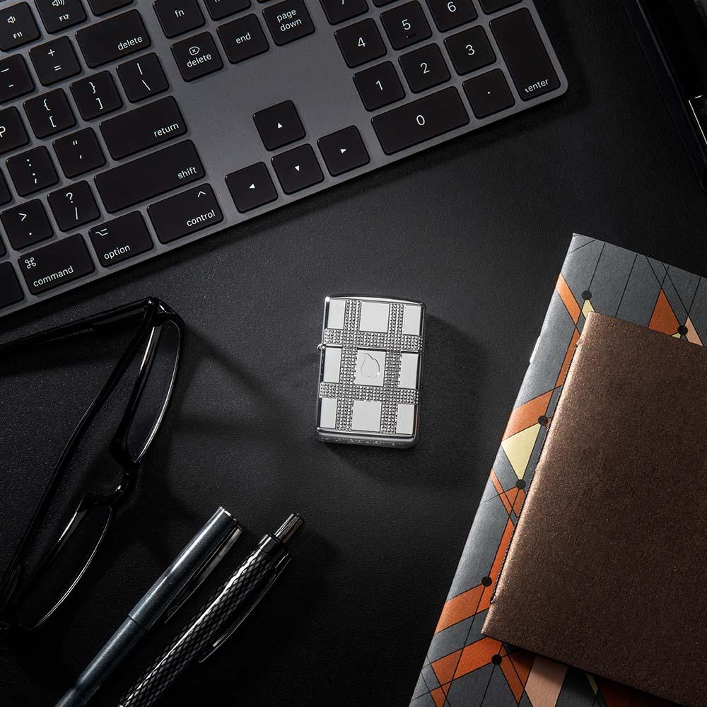 Lifestyle Image of Geometric Design High Polish Chrome Ice Windproof Lighter